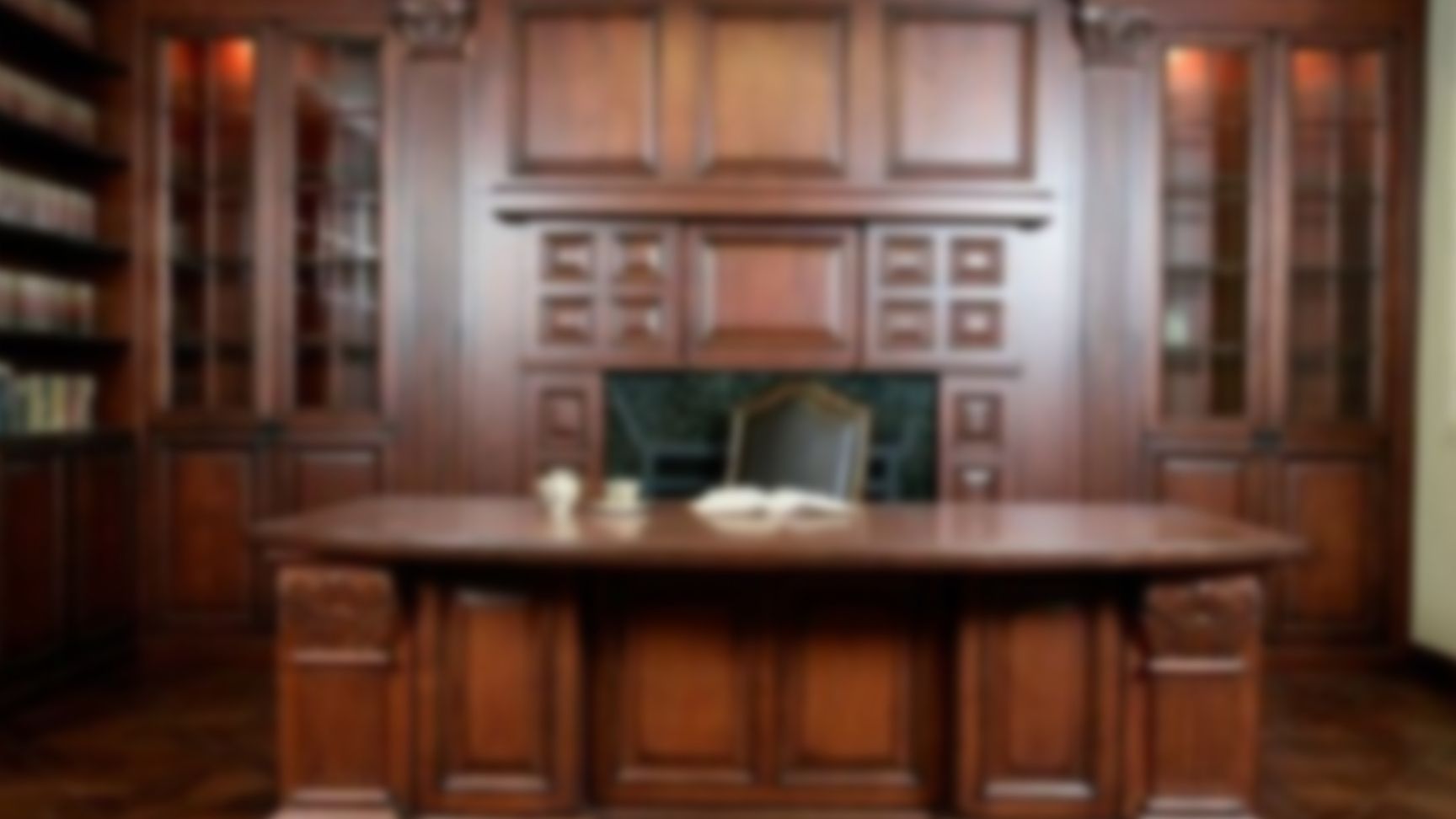 The third background, a formal, blurred desk. 