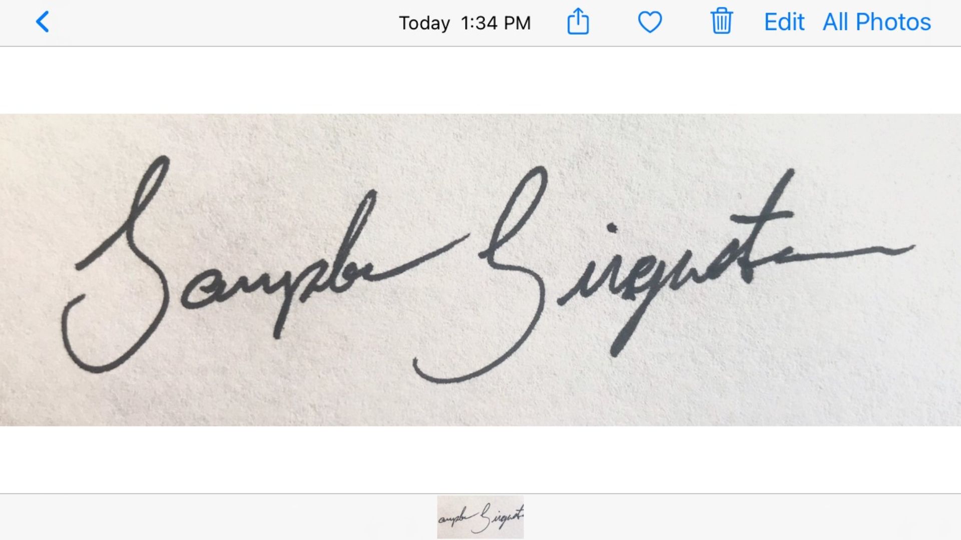 A sample signature, written on white paper. 