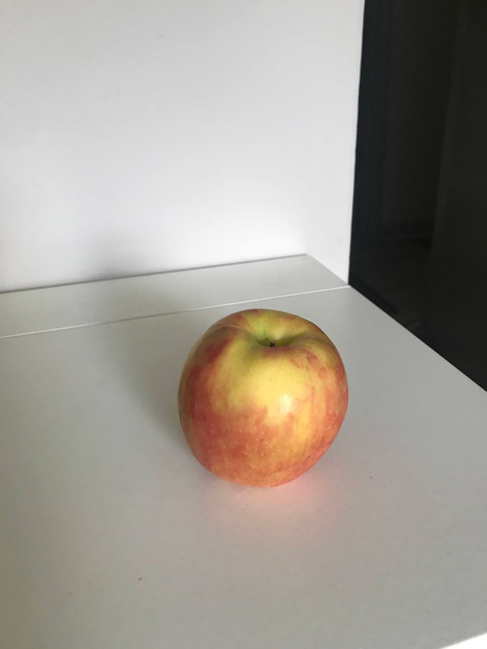 An apple against a white backdrop.