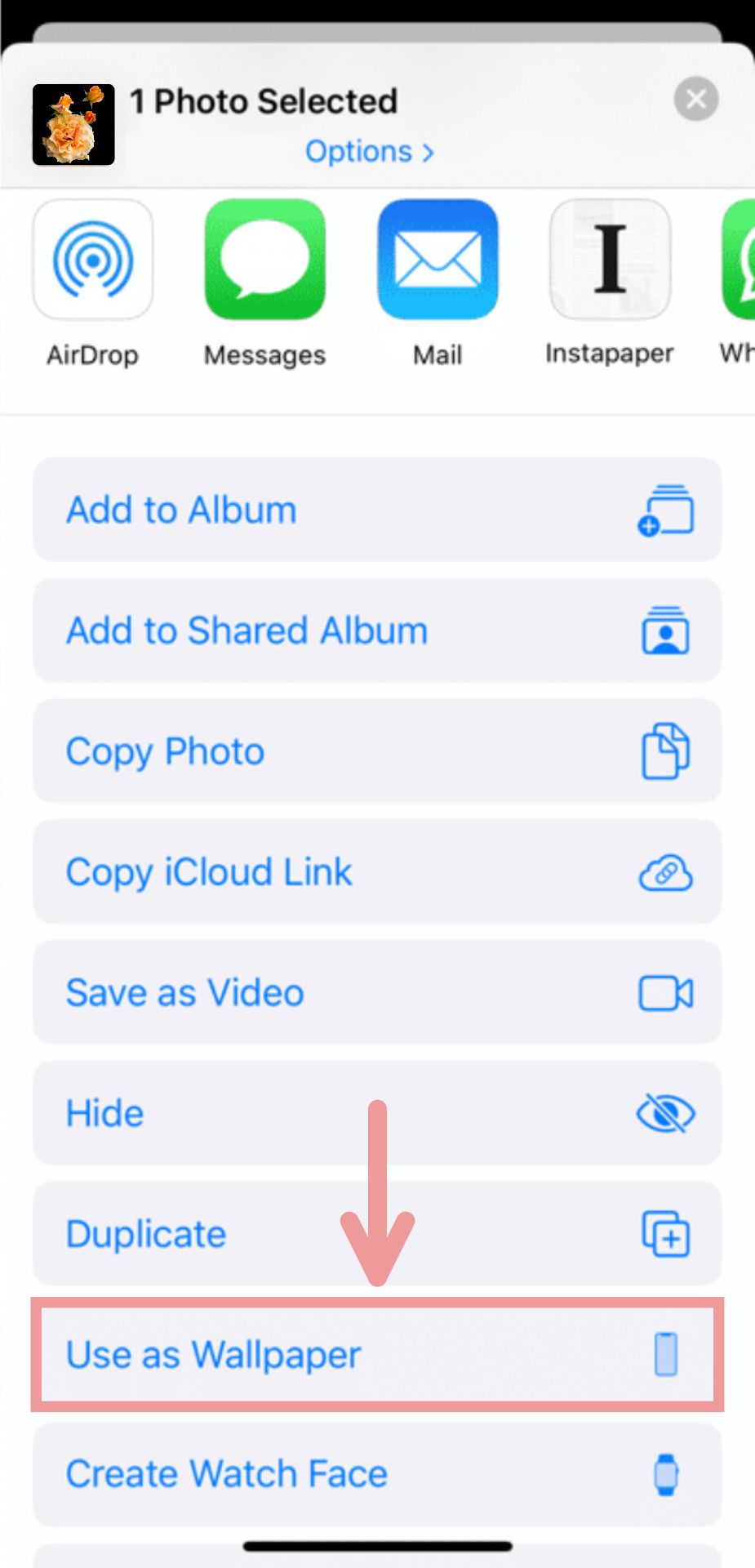 A screenshot showing how to use saved photos as wallpaper images on an iPhone. 